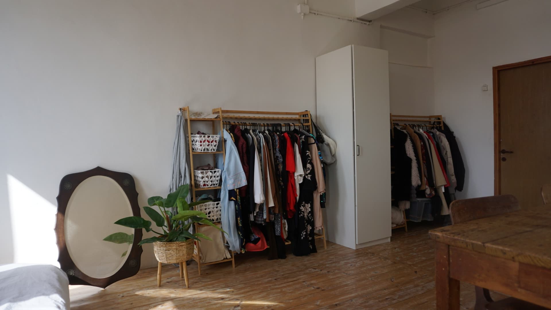 Dressing area — racks, wardrobe, mirror, natural light